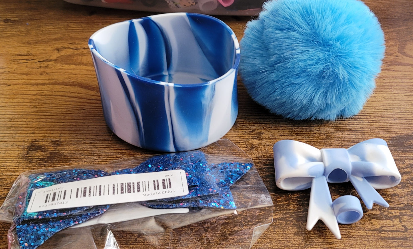 Silicone bottoms with pom poms for cups