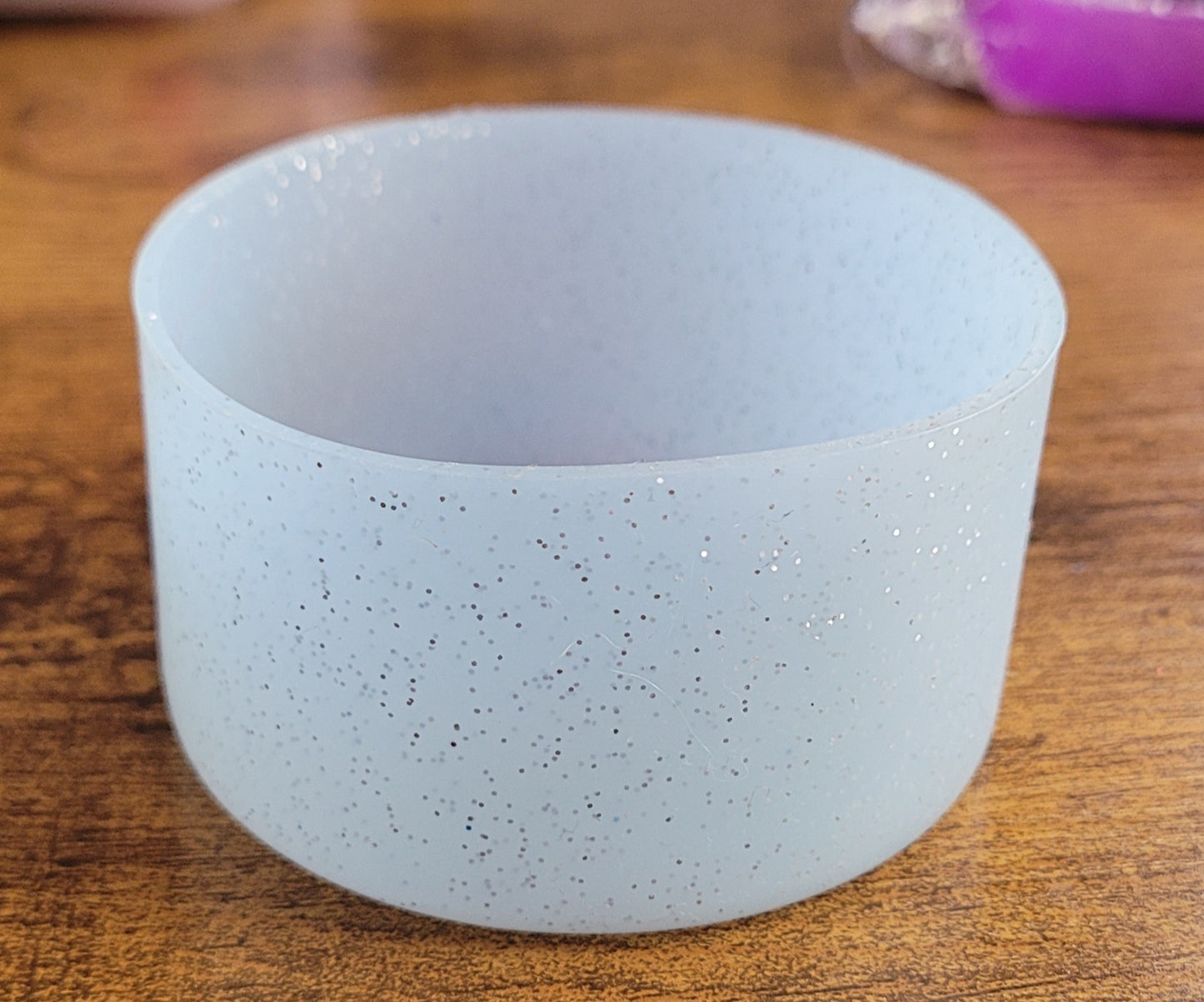 Silicone bottoms with pom poms for cups