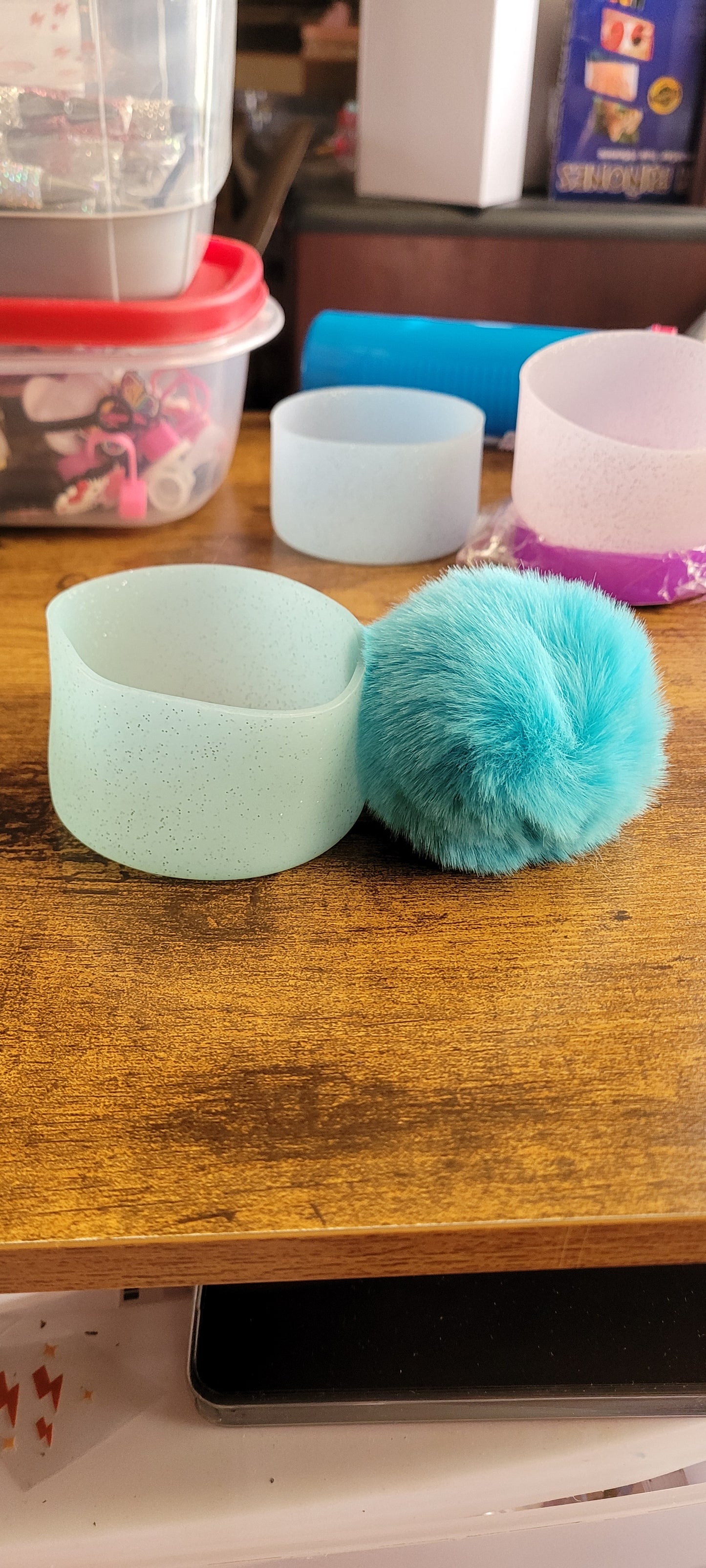 Silicone bottoms with pom poms for cups